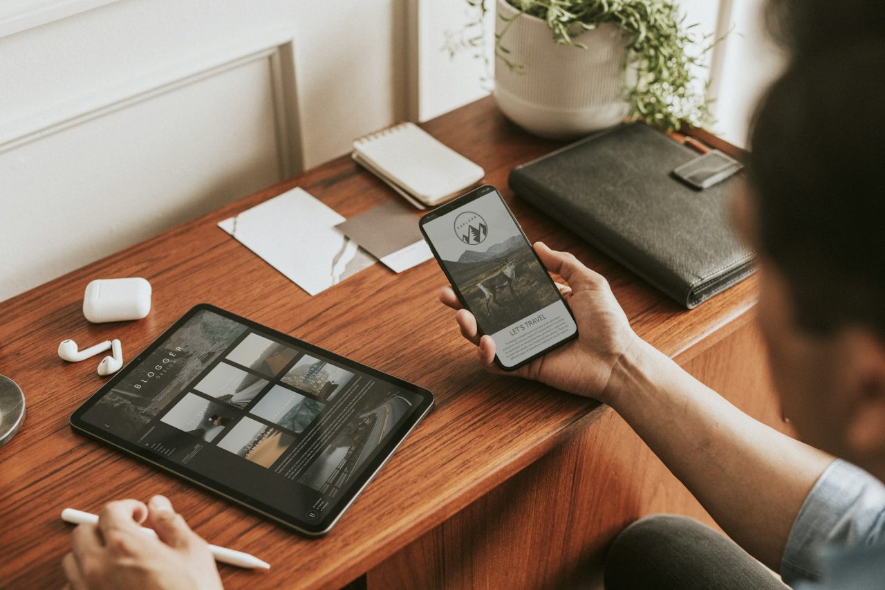 Smartphone screen mockup placed on a desk workspace