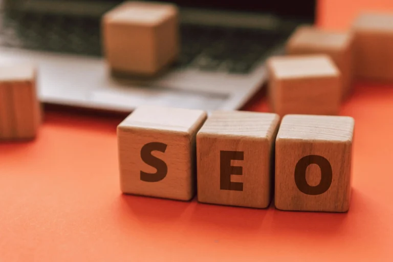 SEO concept with wooden blocks spelling SEO